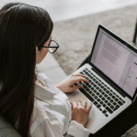 Freelance writer using her laptop to work on an assignment.