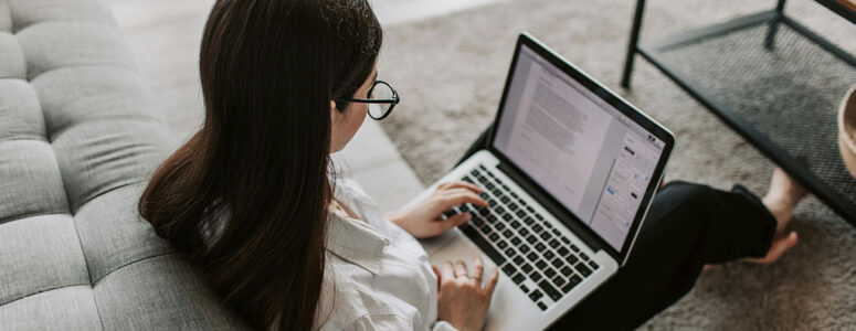 Freelance writer using her laptop to work on an assignment.