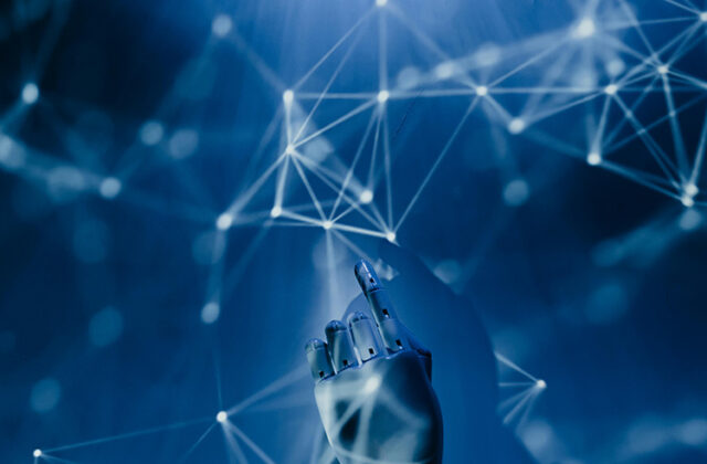 Robotic hand pointing to a web of interconnected lights across a blue background