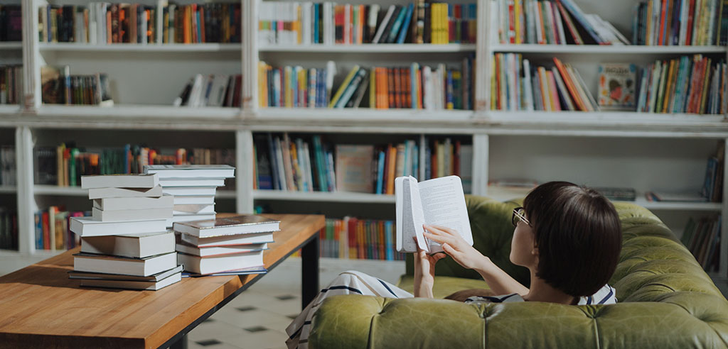A book influencer is reading a book