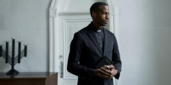 Pastor standing in a room contemplating his side hustle.