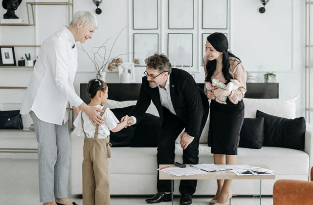 Social worker introducing a child to their foster family.