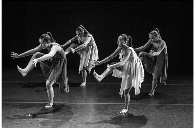 Dance students in class learning new dance moves