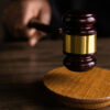 Close view of a gavel representing a legal proceeding that might be transcribed.
