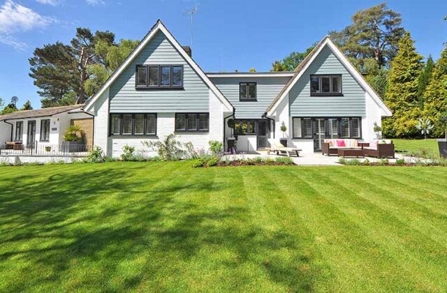 Suburban home with a well-maintained lawn, courtesy of someone's landscaping small business.