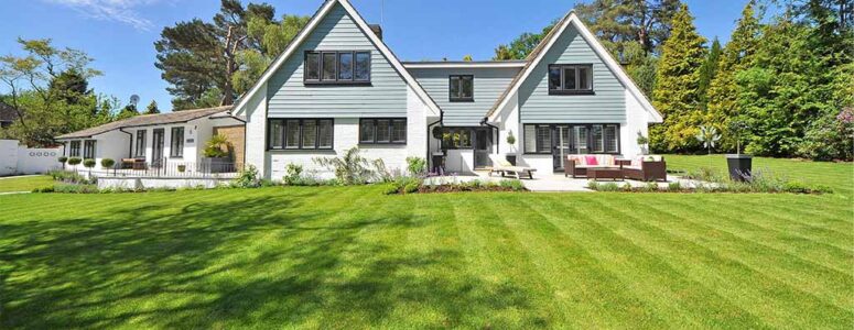 Suburban home with a well-maintained lawn, courtesy of someone's landscaping small business.