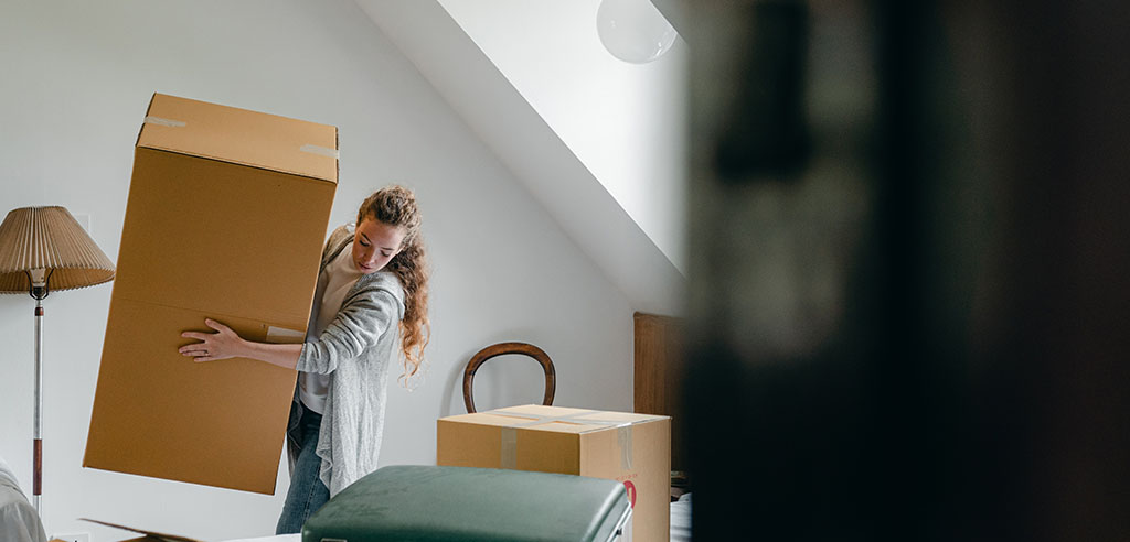 a woman is helping her neighbor move out