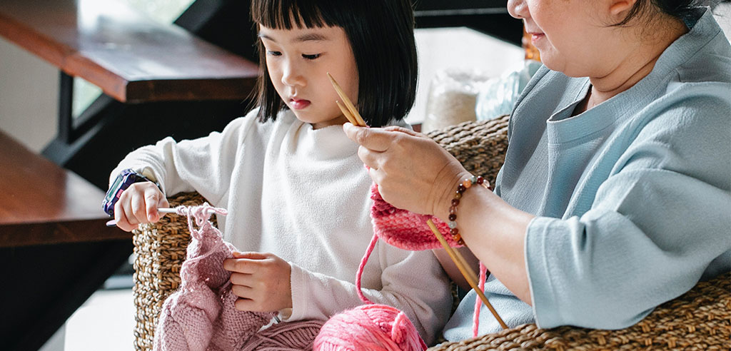 a girl is making handmade craft