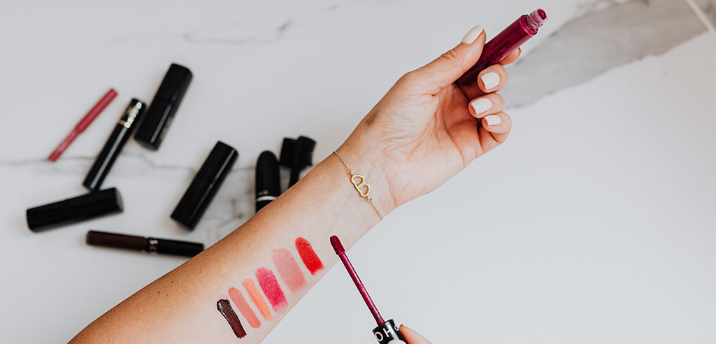 testing and reviewing different lipstick shades
