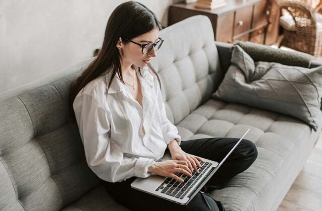 Data entry worker completing a job on her laptop.