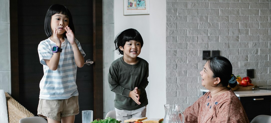 An Asian grandma having fun with her grandchildren.