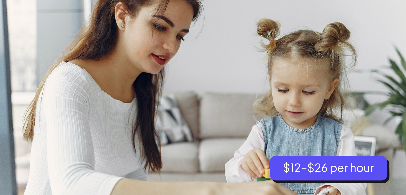 Woman playing with a child as part of her babysitting side hustle