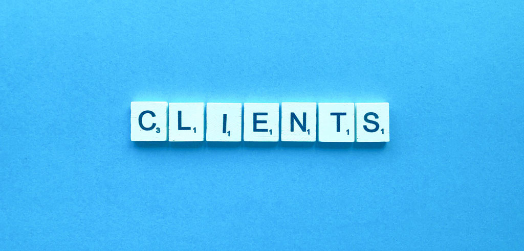 Scrabble chips spelling out the word Clients