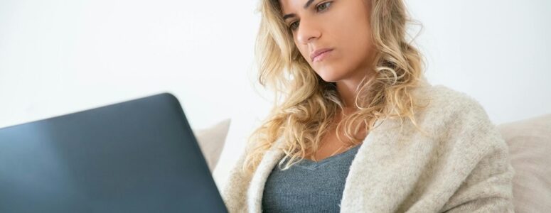 Contently freelancer working on her laptop.