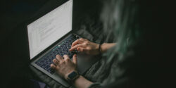 Freelance copywriter working on her laptop.