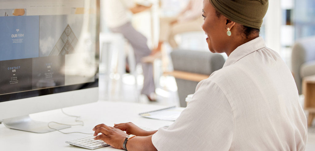 Freelance event planner working on her side hustle at her computer