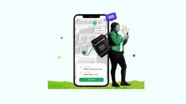Delivery gig worker carrying an order in front of a background showing a delivery app on a smartphone