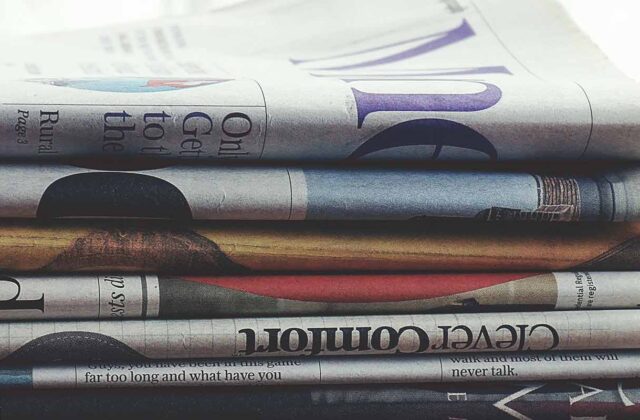 Close view of a stack of newspapers.