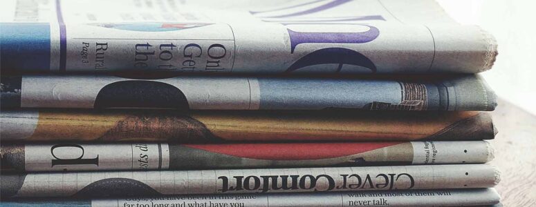 Close view of a stack of newspapers.
