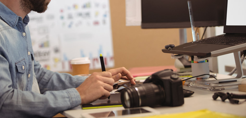 Freelance photographer working at a computer