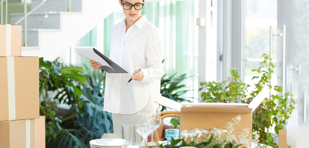 Freelance event planner checking her notes inside a venue
