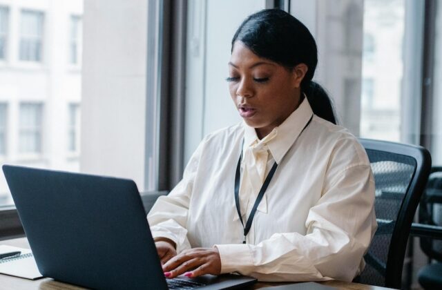 Female employee working on her laptop.
