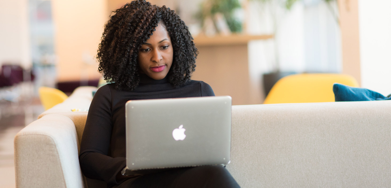 Freelance proofreader working on a project on her laptop