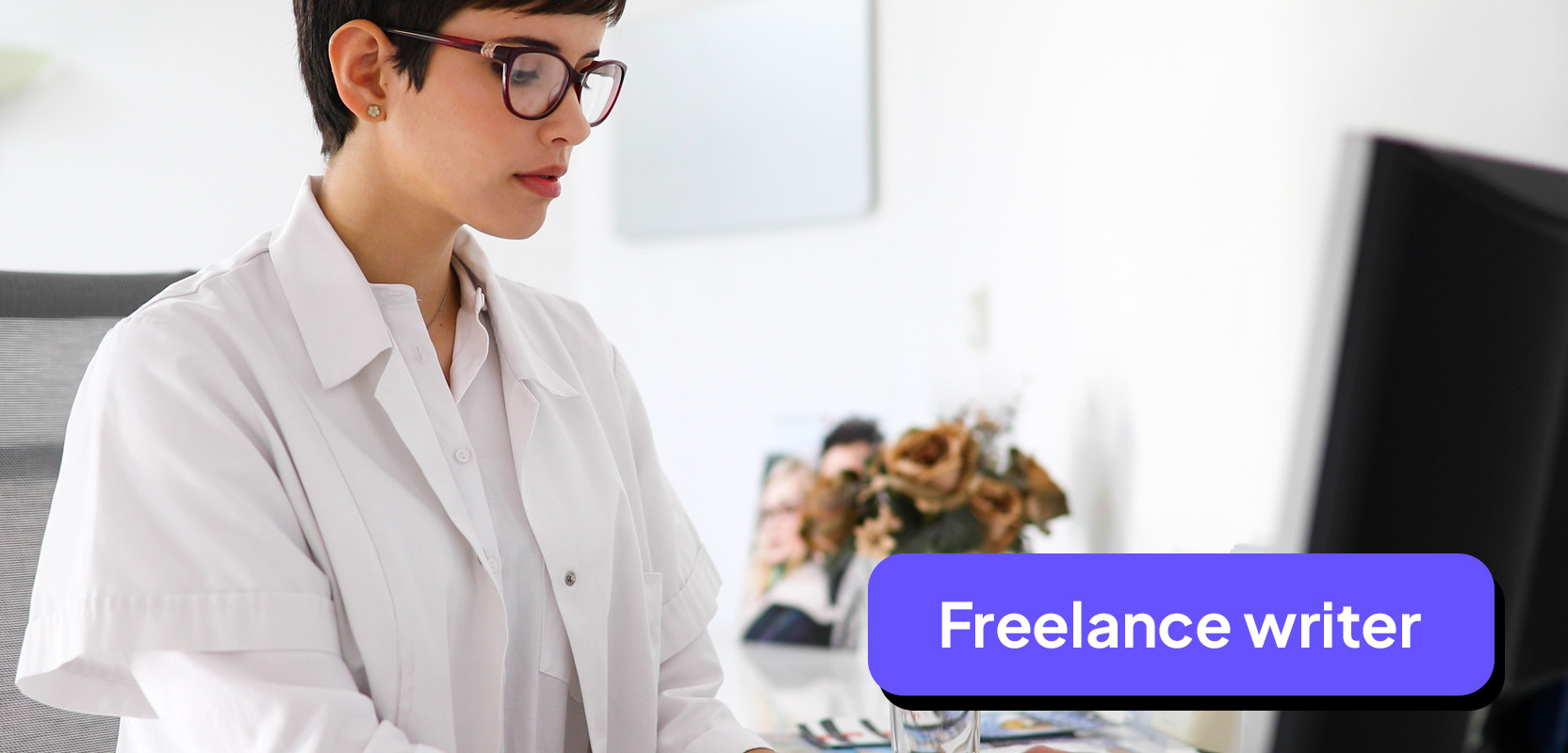 Nurse sitting at a laptop working on her freelance writing side hustle