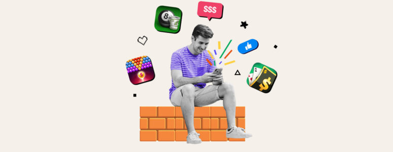 Man sitting on wall playing a game on his phone surrounded by logos of games that pay real money