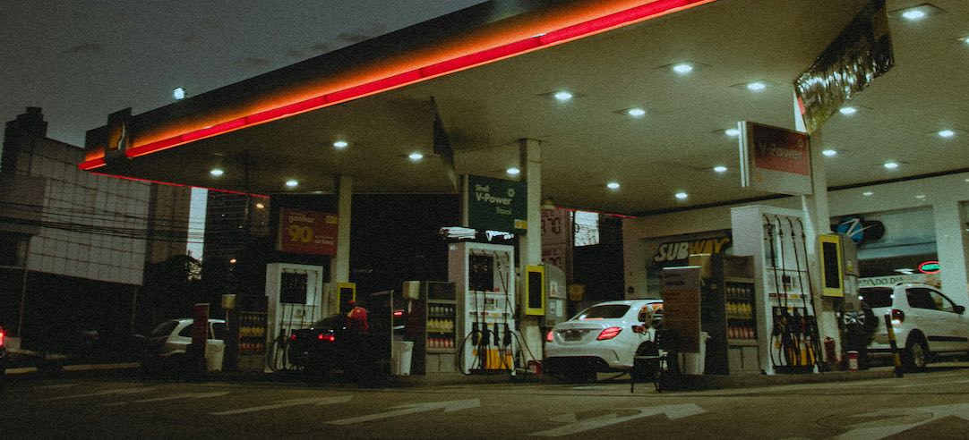 Photo of a gas station at night.