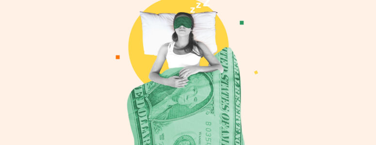Woman lying in bed under a dollar-patterned blanket representing getting paid to sleep as a side hustle