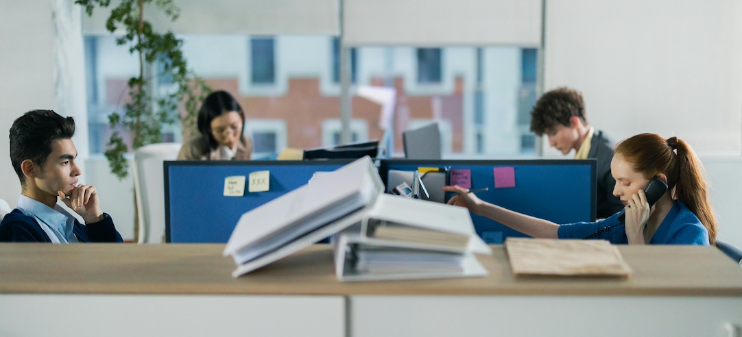 Group of employees working in an office.