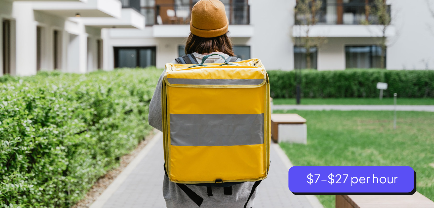 Gig worker carrying a large package for delivery