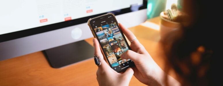 A hiring manager reviewing a job applicant's photos posted on their personal social media account.