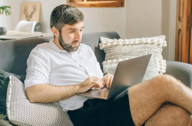 Man using his laptop while passively sharing his bandwidth on Honeygain.