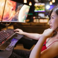Twitch streamer sitting at her computer.