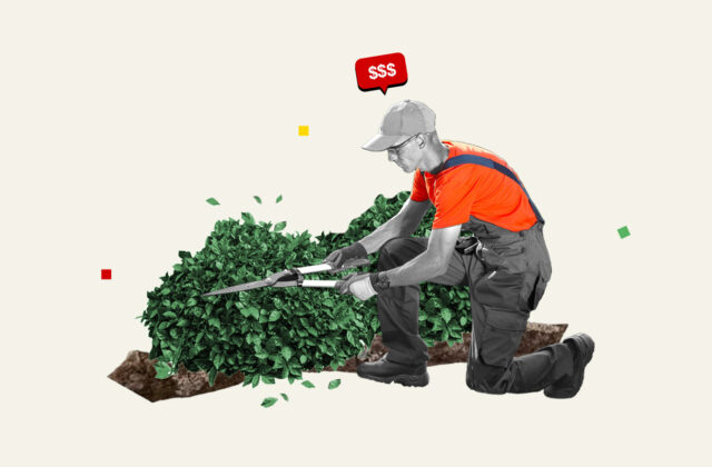 Professional landscaper trimming a hedge.