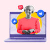 Woman popping out of laptop screen representing becoming a virtual assistant