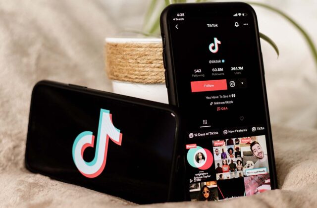 Two smartphones displaying the TikTok logo and profile page for a paid TikToker