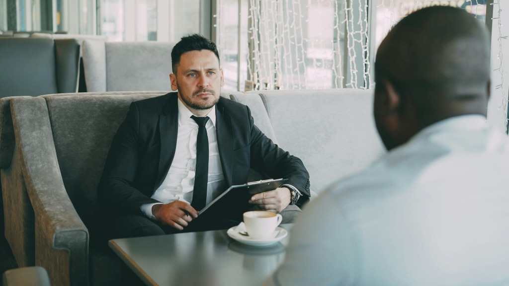 Hiring manager looking uncomfortable in interview after asking an applicant for personal information. 