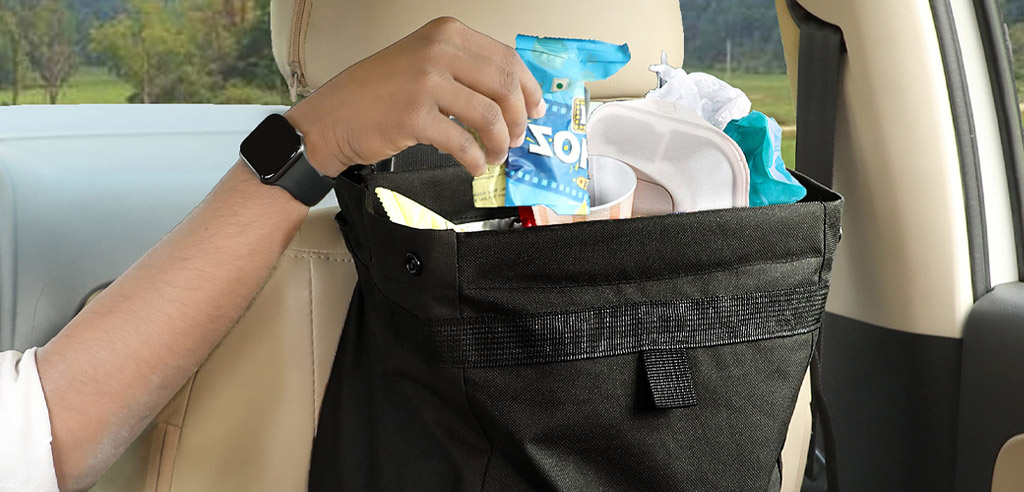 Trash bag hanging on the back seat of an Uber or Lyft car