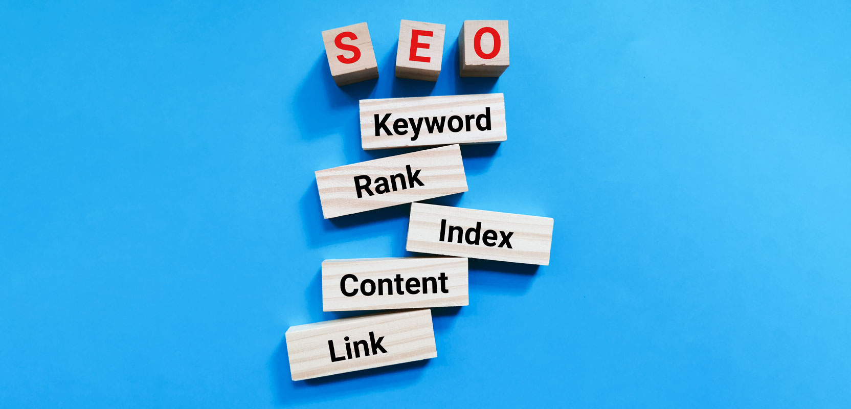 Pile of wood blocks with words related to SEO on them