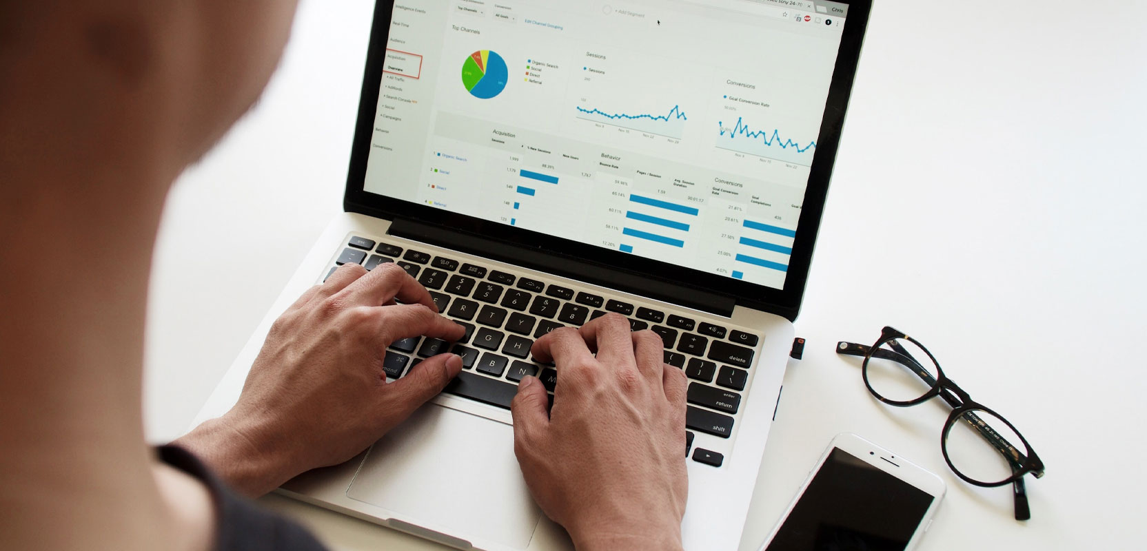 Woman looking at graphs and other data for their proofreading business