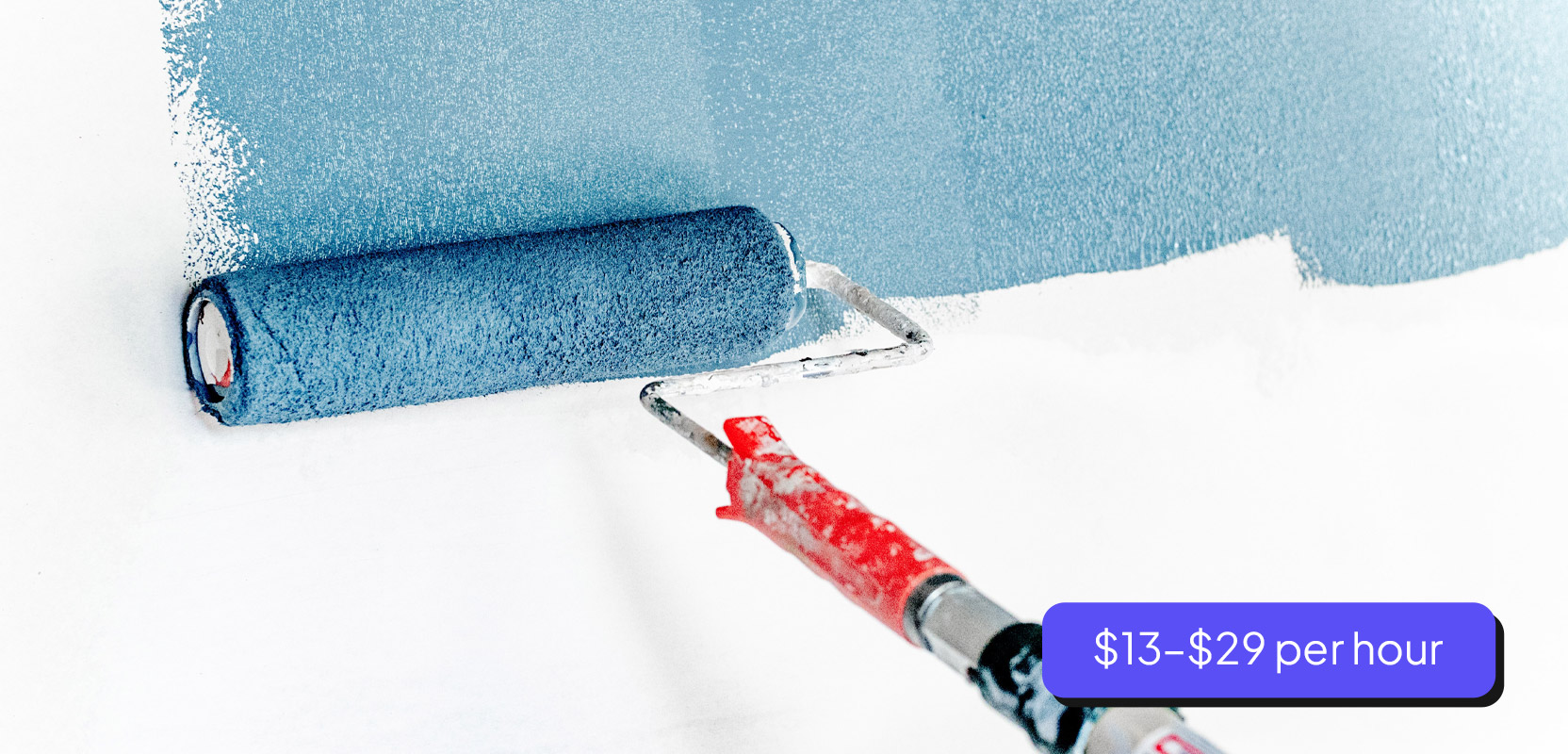 White wall being painted in blue