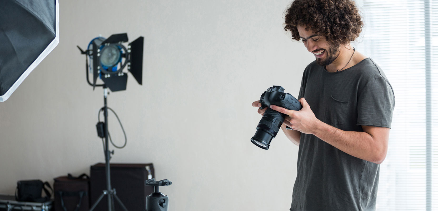 Photographer checking his camera during a shoot