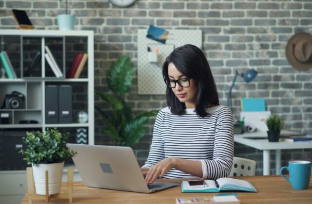 Pinterest virtual assistant working from home on her laptop.