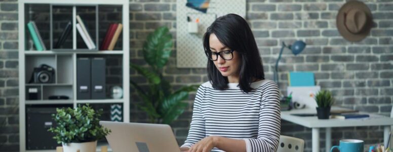 Pinterest virtual assistant working from home on her laptop.
