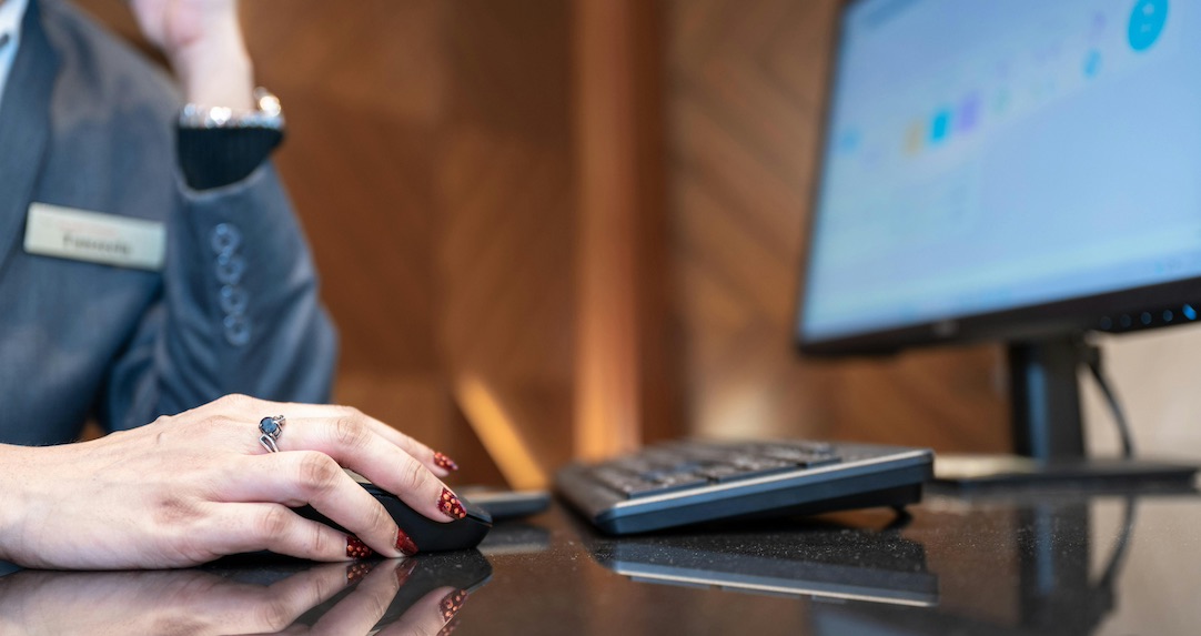 Receptionist using a computer.
