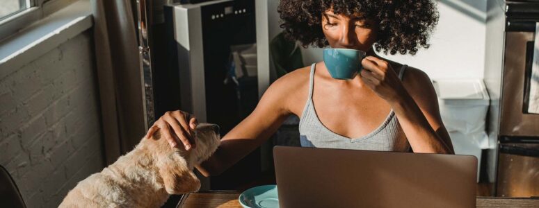 Freelance writer sitting at her laptop working on a project