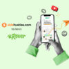 Two hands holding a smartphone displaying available jobs in the Rover app